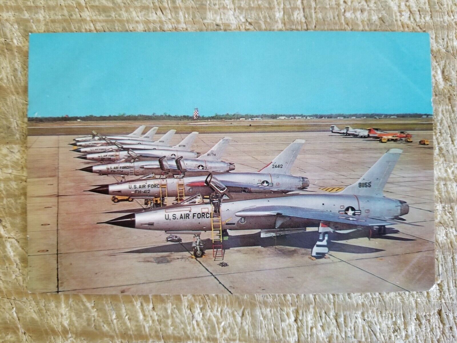 SEVEN F-105 THUNDERCHIEF JET FIGHT BOMBERS AT EGLIN AFB,FL.VTG POSTCARD*P20