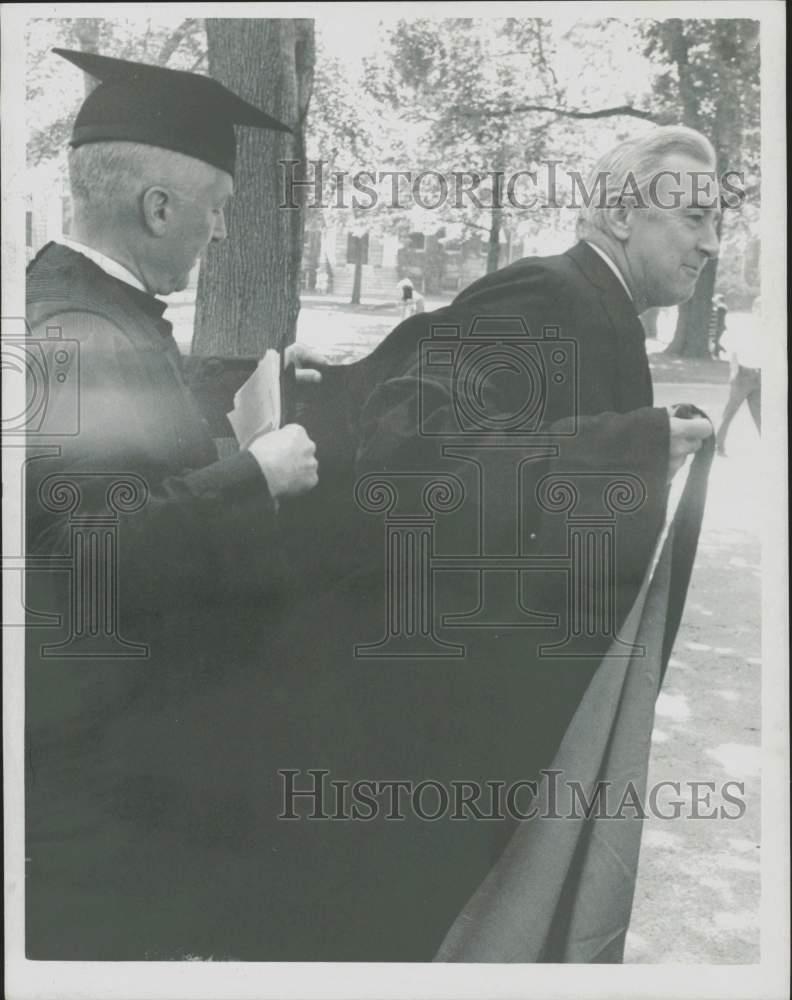 1969 Press Photo President Pusey helps Eugene McCarthy with his robes at Harvard