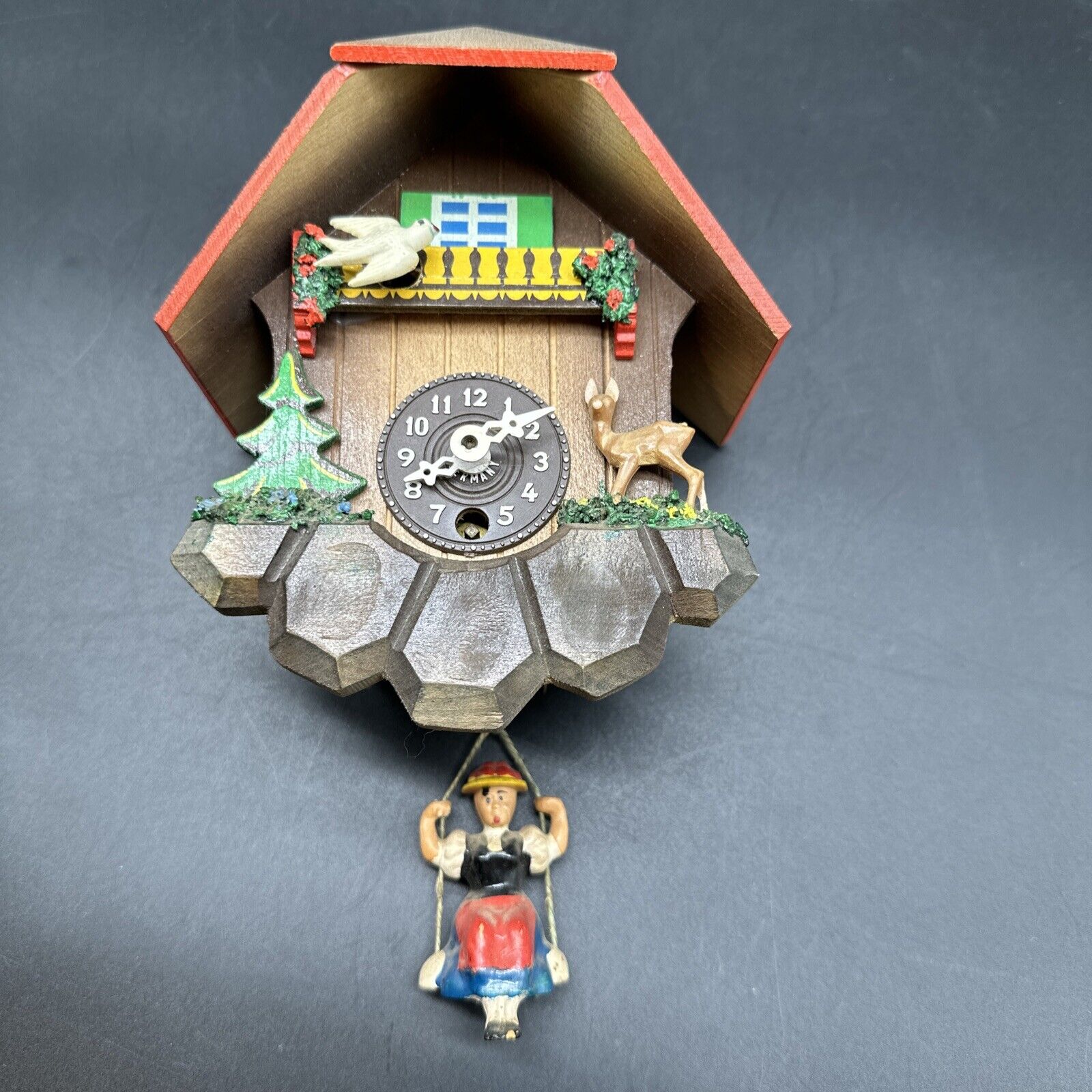 VINTAGE BLACK FOREST SWISS CHALET CUCKOO STYLE  CLOCK WITH BOUNCING GIRL  GERMAN