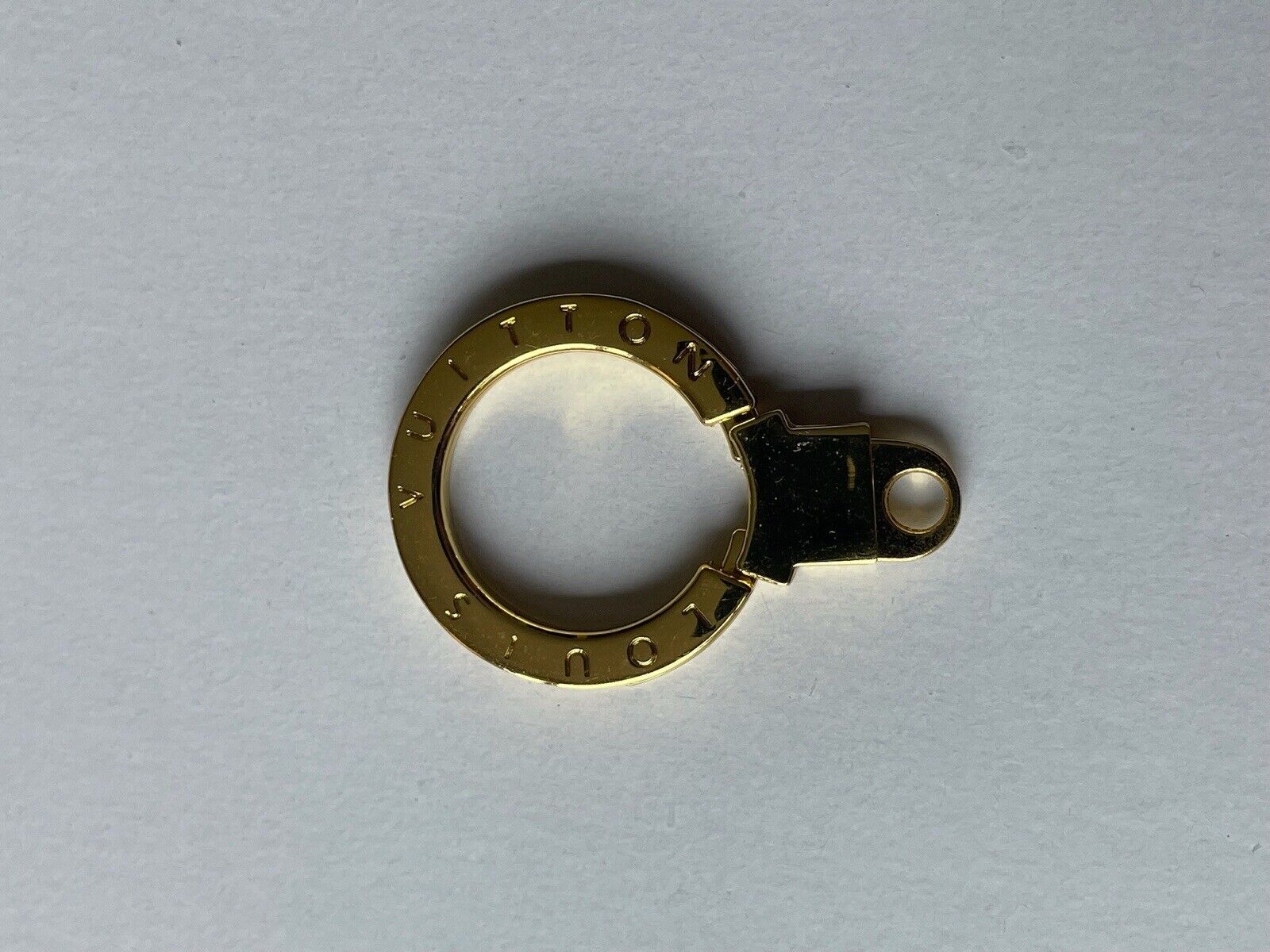 One LOUIS VUITTON LV Logo Button Metal Gold tone zipper pull Charm 40 x 28 mm