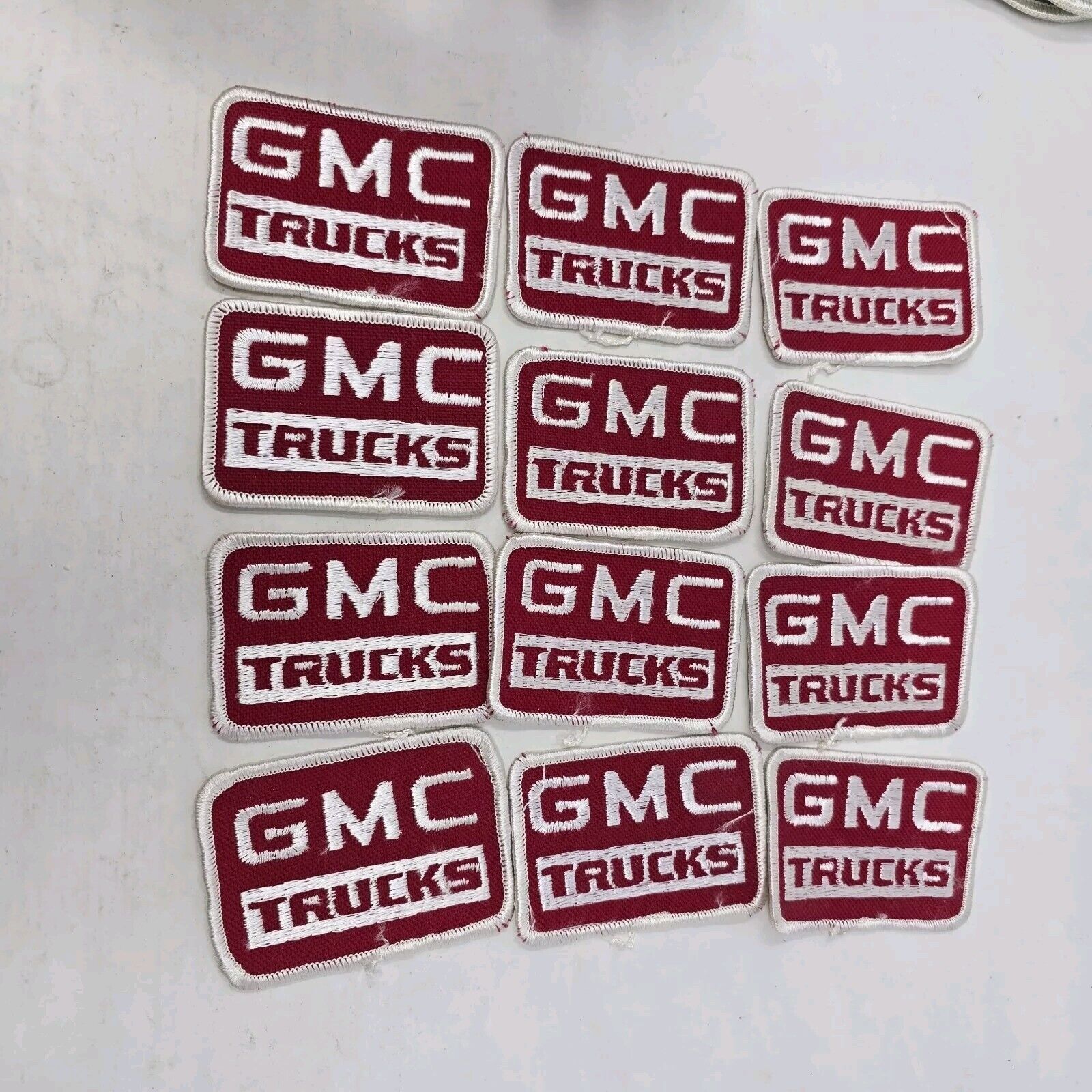 Lot Of 12 Vintage GMC Trucks Small Rectangular Sew On Patches, NOS