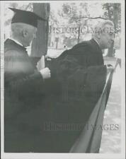 1969 Press Photo President Pusey helps Eugene McCarthy with his robes at Harvard picture