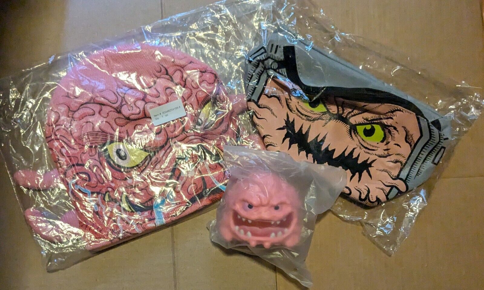 NECA Loot Crate Krang collectibles - beanie, waist pack, and stress ball