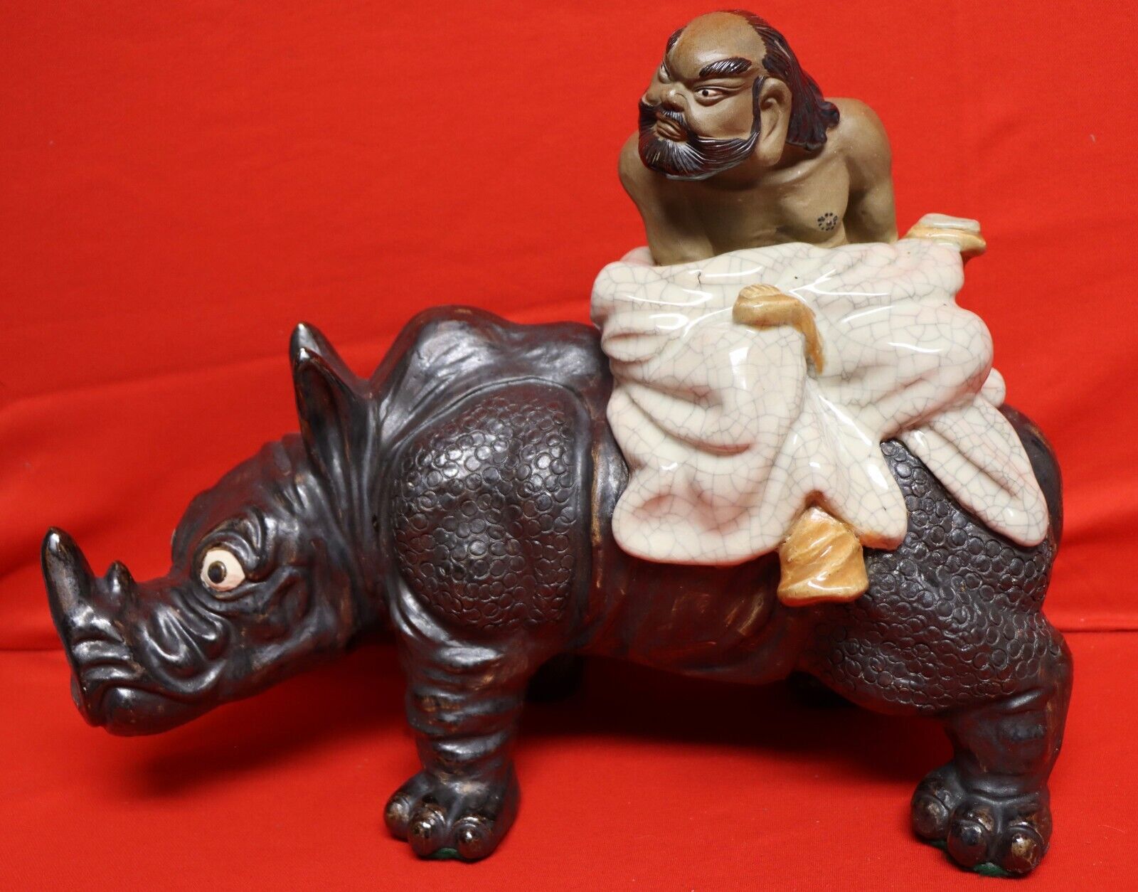 BUDDA MAN RIDING ON A Rhino Porcelain -Heavy 18.2lb. Tag No. G450.