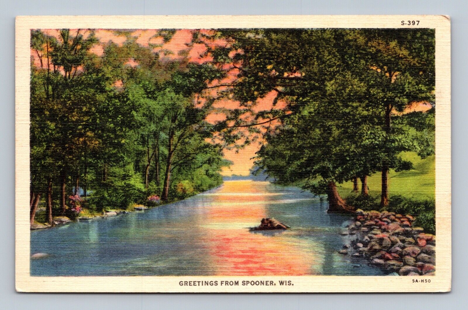 Greetings from Spooner Wisconsin Postcard