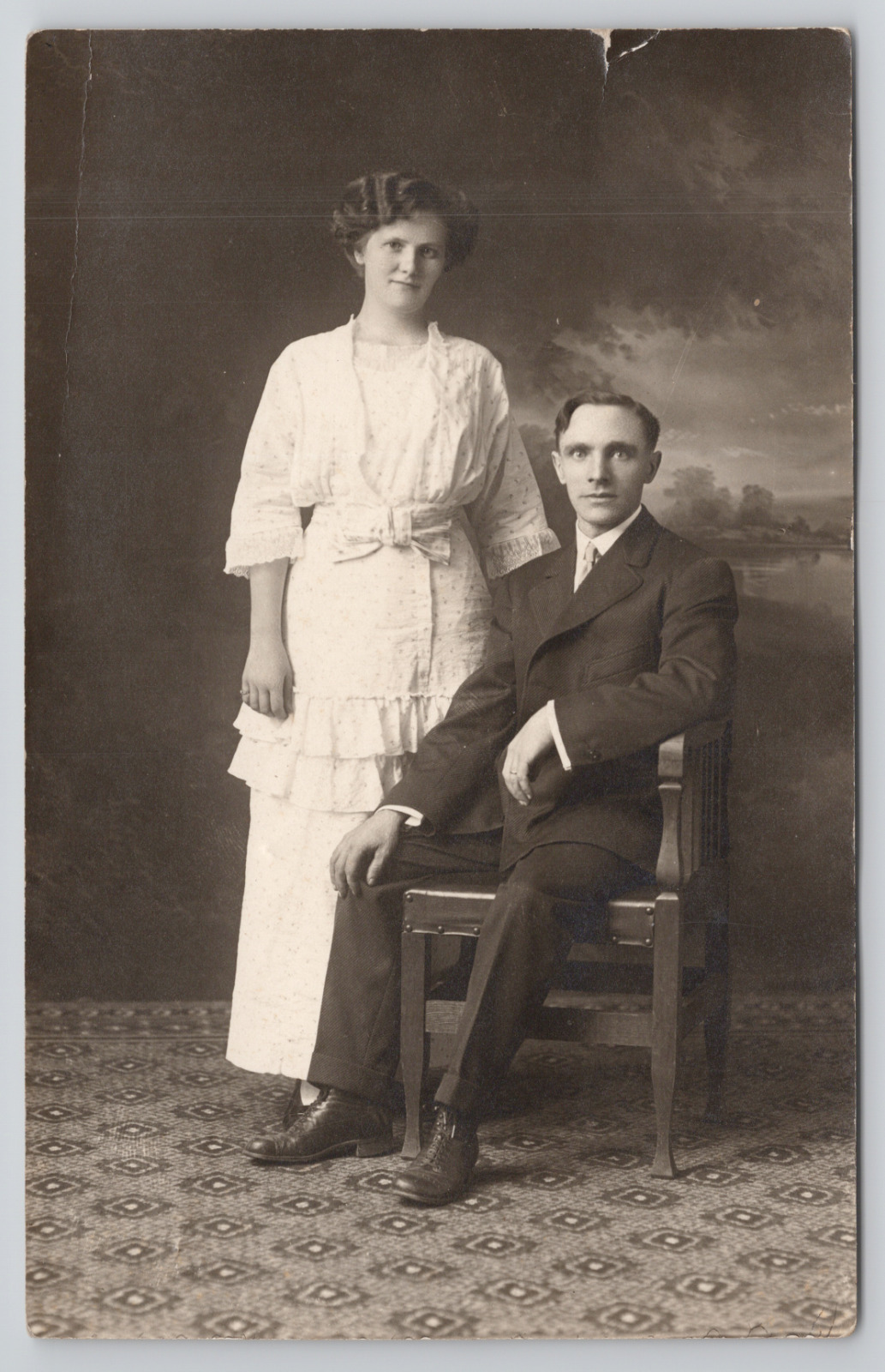 Real Photo Postcard Couple in Studio Looking Relaxed c1920 RPPC