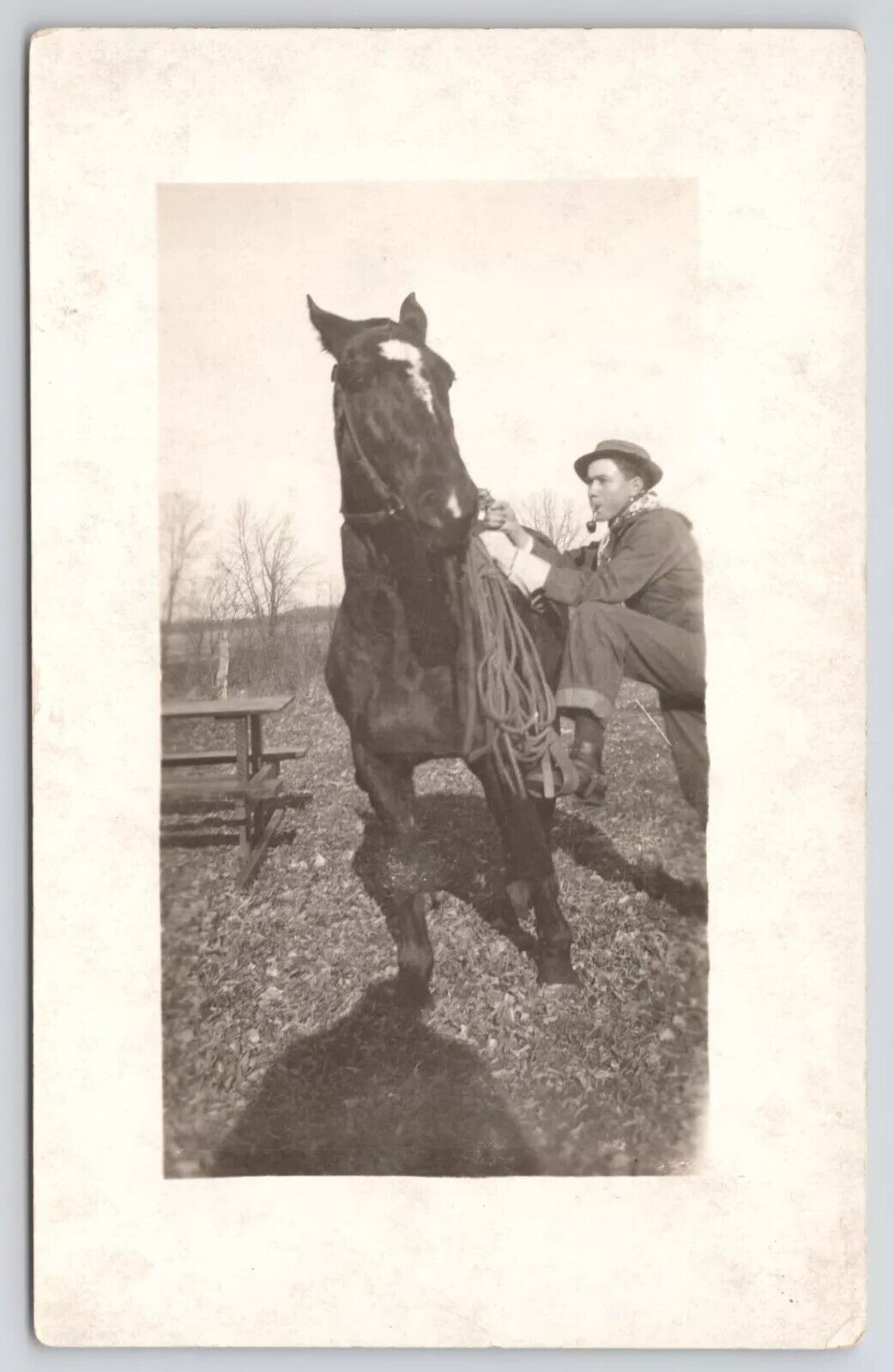 RPPC Man With Pipe In Mouth Mounting Horse c1910 Real Photo Postcard
