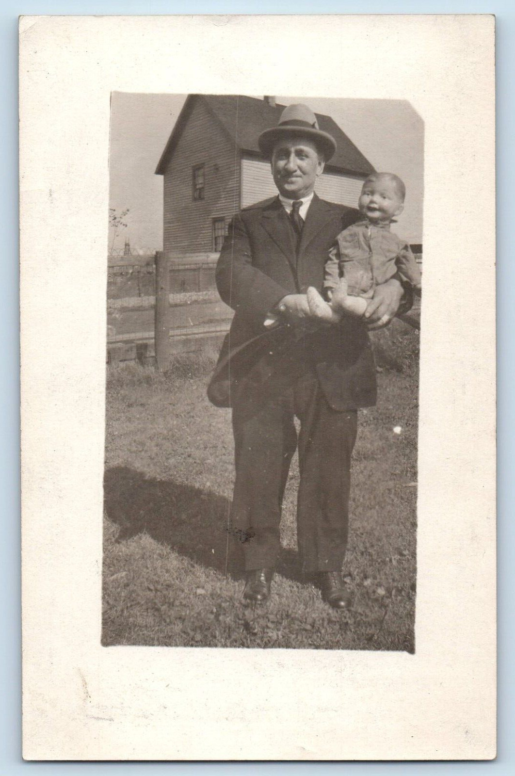 c1910s Man With Baby Doll Weird Ventriloquist RPPC Photo Postcard