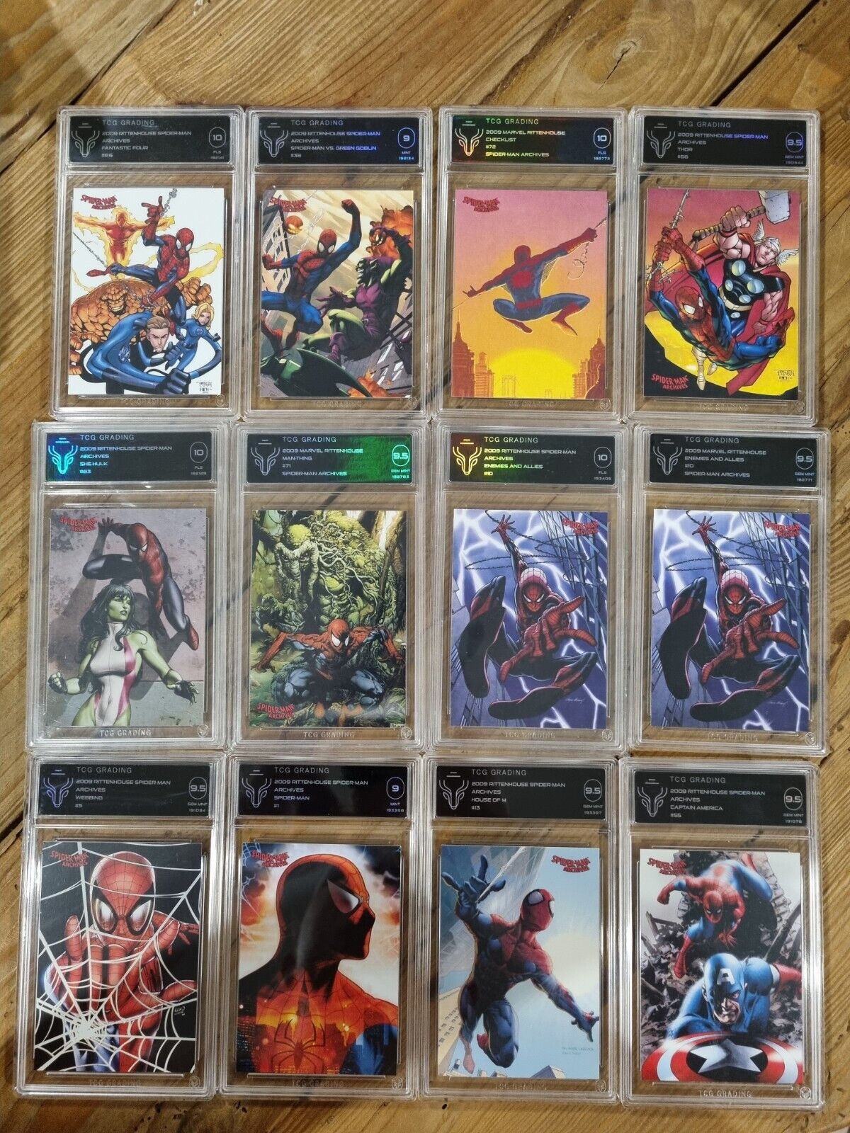 12x SLABS - 2009 Marvel Rittenhouse Spiderman X12 TCG Graded Cards.    NOT TAG