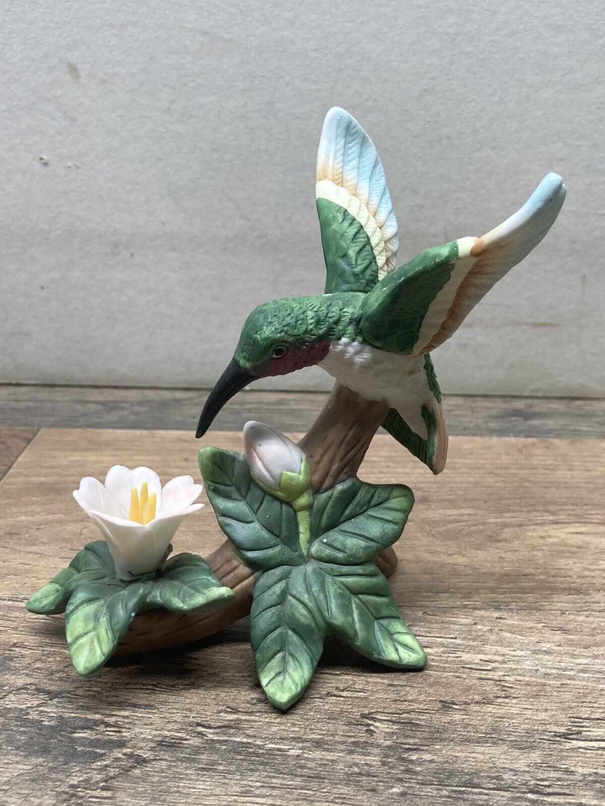 Vintage small hummingbird figurine green and white wings, ruby throat, flower